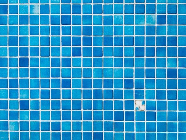 A broken tile is never fun to see in a pool. Look for ways to replace it. Photo by David Pisnoy.
