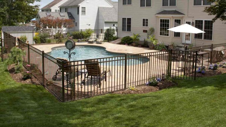 Aluminum pool fence around the in-ground pool.